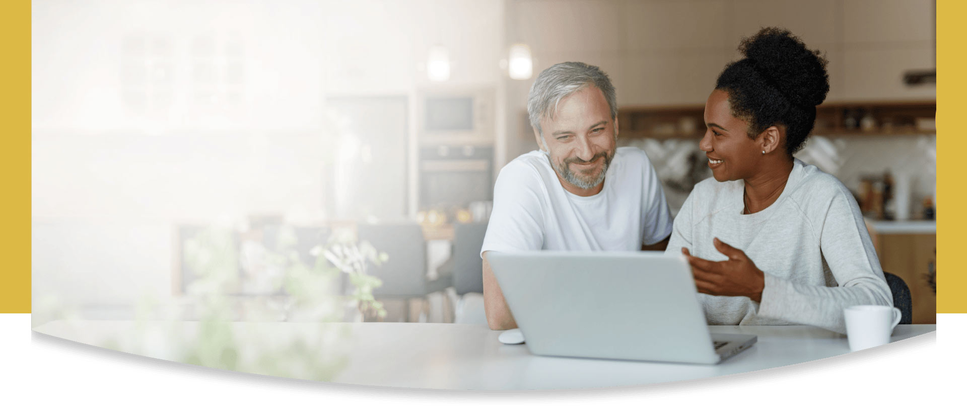middle aged man and woman using the computer together
