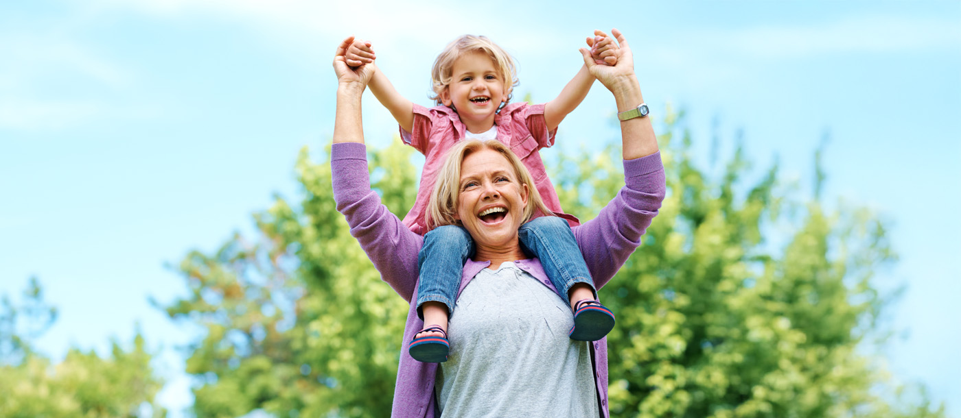 grandmother with child on shoulders