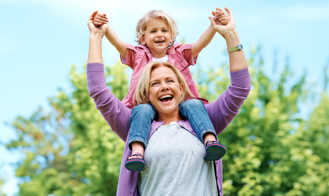 grandmother with child on shoulders