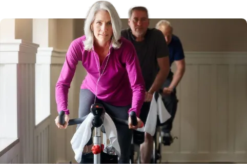 older woman using exercise bike